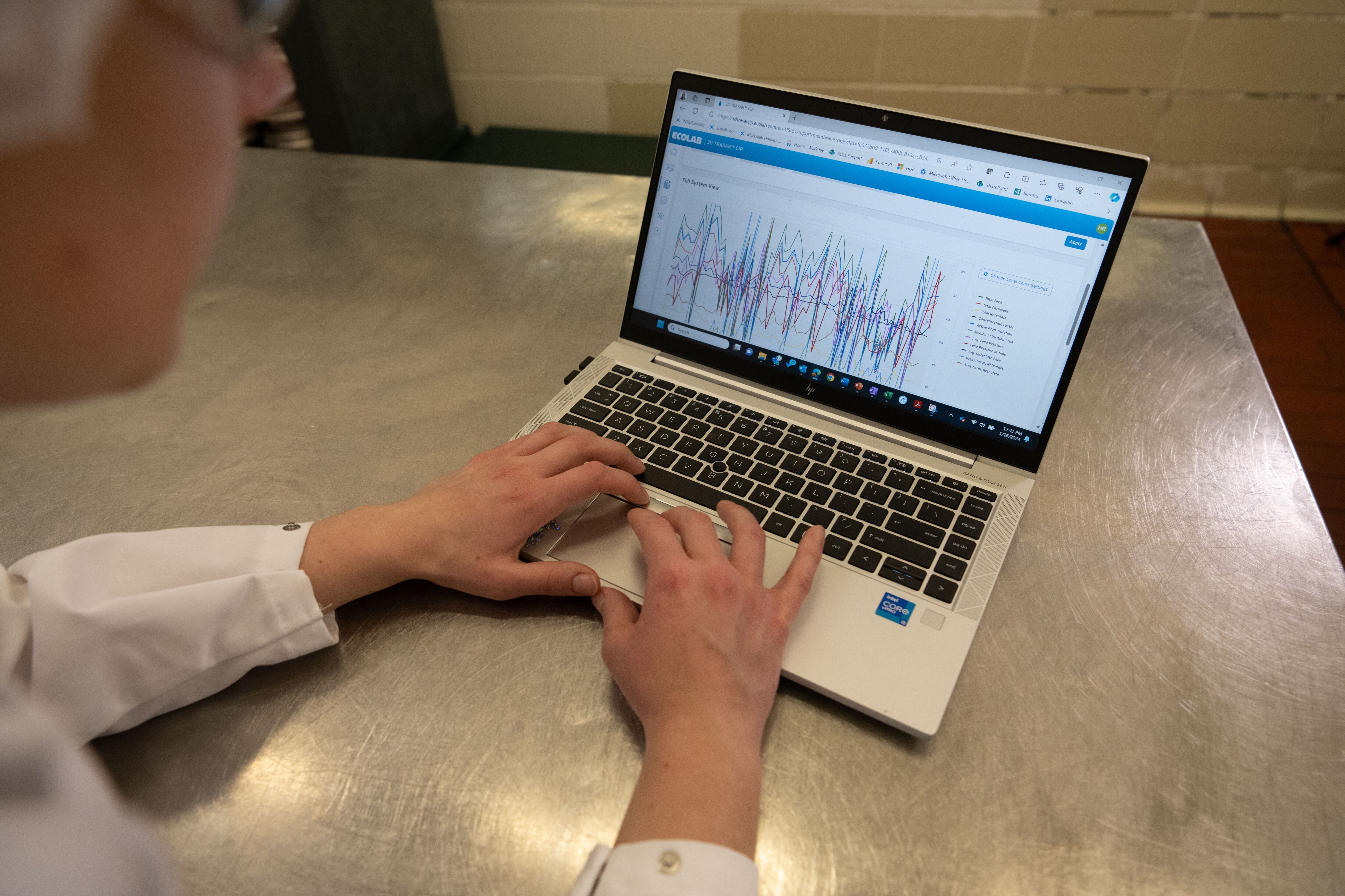 A person looking at information on a computer